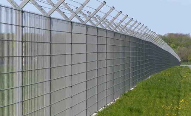 video surveillance security fence with barbed wire